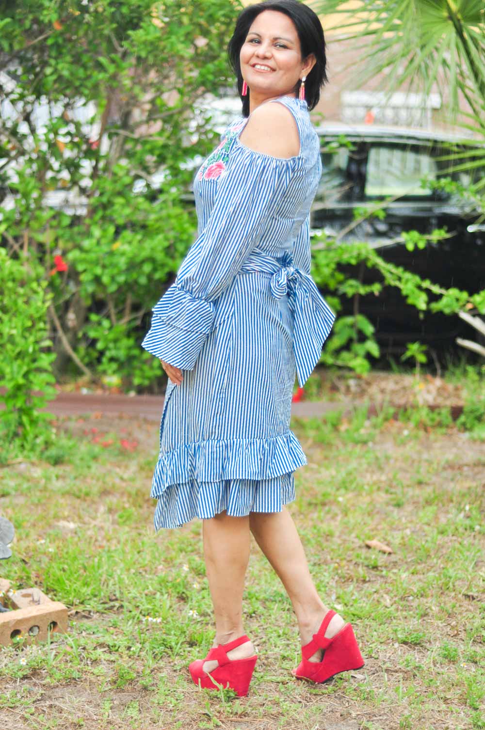 blue striped dress and statement earrings for spring or summer outfit